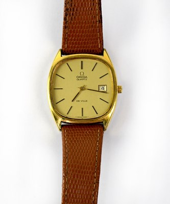 Lot 1402 - OMEGA; a gold plated Deville quartz tank-style...