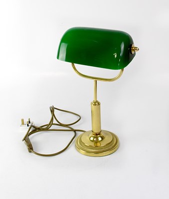 Lot 131 - A reproduction brass-effect library lamp with...