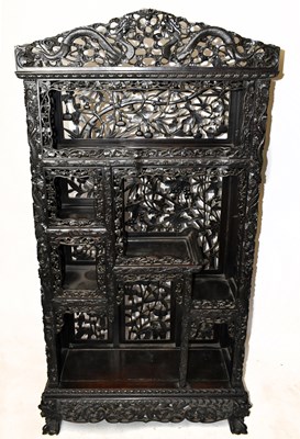 Lot 643 - An early 20th century Chinese carved rosewood display shelf