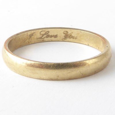 Lot 1143 - A 9ct gold band ring, size N, approx. 1.8g.
