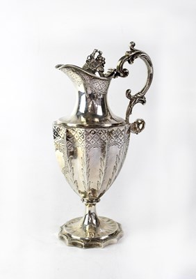 Lot 916 - A George III hallmarked silver claret jug of...