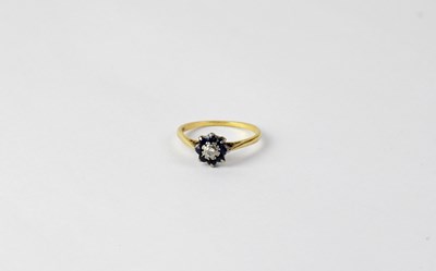 Lot 1089 - An 18ct yellow gold dress ring floral set with...