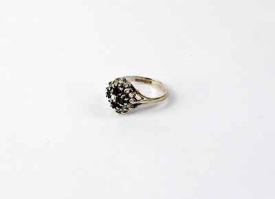 Lot 1133 - A 9ct yellow gold dress ring, floral marquise...