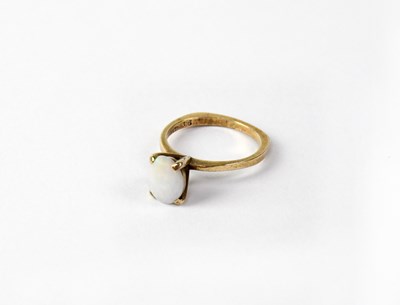 Lot 1135 - A 9ct yellow gold dress ring set with oval...