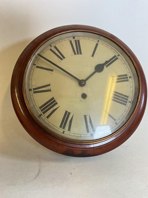 Lot 402 - A mahogany circular wall clock with pendulum,...