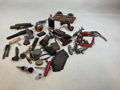 Lot 206 - A collection of corkscrews, pen knives, nut...