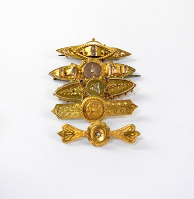 Lot 1203 - Four 9ct bar brooches, one a mourning brooch,...