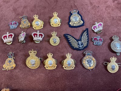 Lot 41 - A collection of military badges, archery...