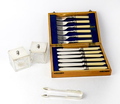 Lot 904 - A small quantity of silver items comprising a...