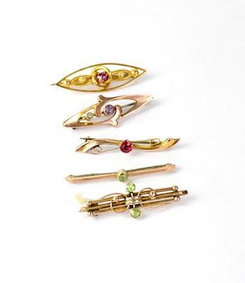 Lot 1204 - Five 9ct gold bar brooches set with semi...