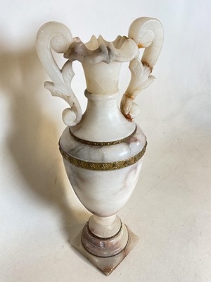 Lot 231 - An alabaster vase with twin handles, height...