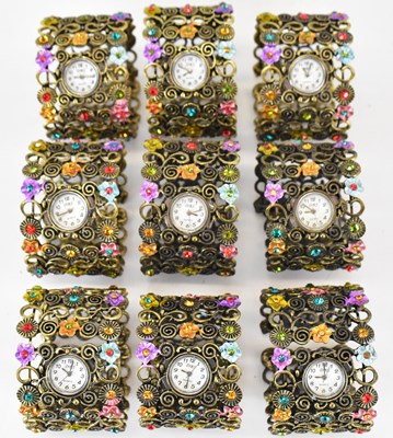 Lot 1436 - Nine modern matching ladies' floral gilt...