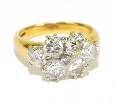 Lot 890A - An 18ct yellow gold dress ring set with six...