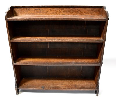 Lot 63 - A mid-20th century oak bookcase with four open...