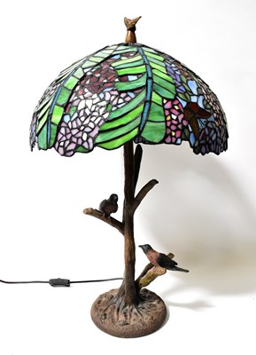 Lot 134 - A Tiffany style leaded stained-glass lamp, the...