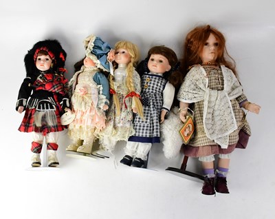 Lot 259 - Ten porcelain costume display dolls, various...