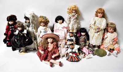 Lot 261 - Thirteen porcelain costume display dolls,...