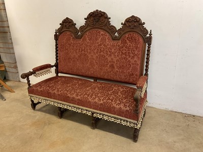 Lot 475 - A Gothic style carved oak three seat banquette...