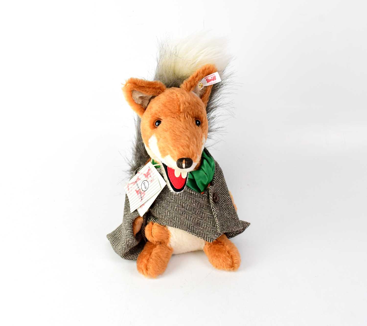 Lot 285 - STEIFF; a 'Basil Brush' plush toy, gold button...