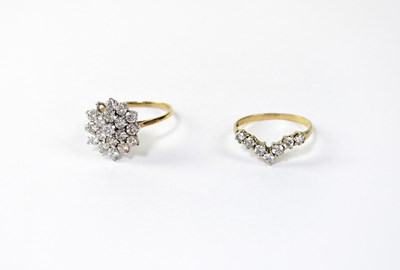 Lot 1118 - Two 9ct gold dress rings, one set with seven...