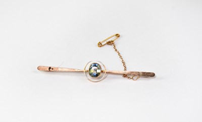 Lot 1193 - A 15ct gold bar brooch set with topaz within...