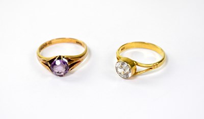 Lot 1030 - A 9ct gold ring set with amethyst within open...
