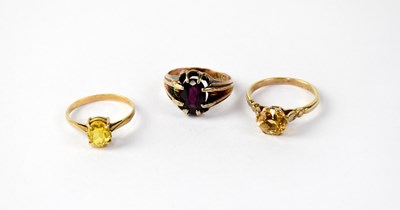 Lot 1064 - Three 9ct gold dress rings comprising one with...