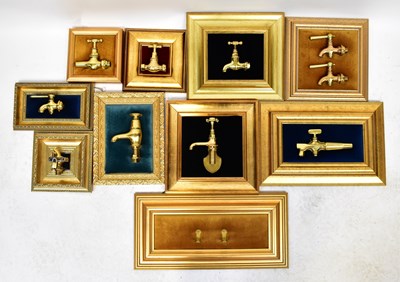 Lot 212 - Nine highly polished brass taps mounted on...