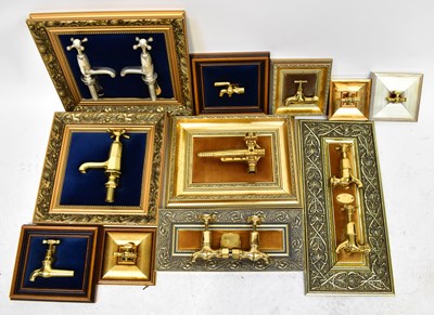 Lot 211 - Ten highly polished brass taps mounted on...