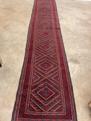 Lot 444 - An Afghan Mushwani runner, 405cm x 75cm.