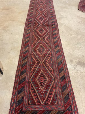 Lot 445 - An Afghan Mushwani runner, 390cm x 77cm.