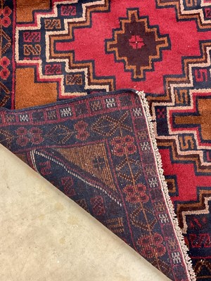 Lot 446 - Two Persian rugs, a traditional Baluchi and...