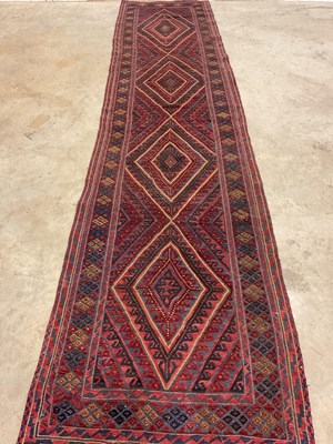 Lot 456 - An Afghan Mushwani runner, 375cm x 89cm.