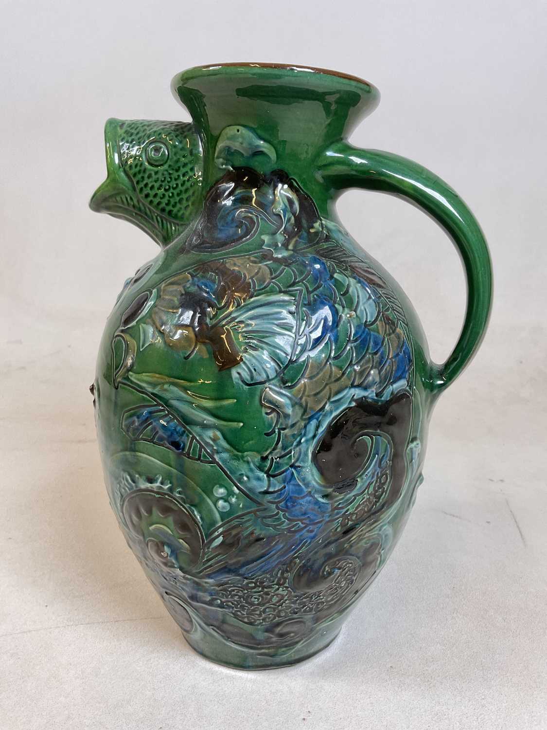 Lot 272 - A Barumware Barnstaple Pottery fish jug with...