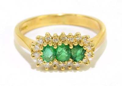 Lot 905F - An 18ct yellow gold diamond and emerald dress...