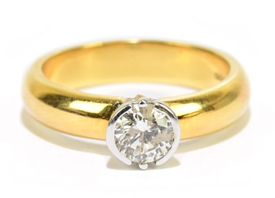 Lot 905L - An 18ct yellow gold diamond solitaire ring,...