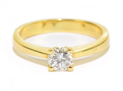 Lot 905M - An 18ct yellow gold diamond set solitaire ring,...