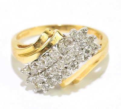 Lot 905X - A 14ct yellow gold diamond panel ring with...