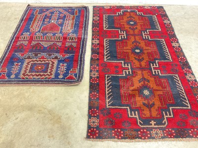 Lot 448 - A Turkish prayer rug and an Afghan Baluchi rug,...