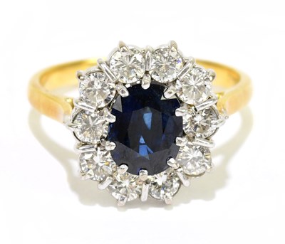 Lot 905T - An 18ct yellow gold sapphire and diamond oval...