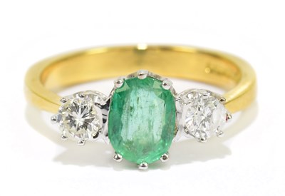 Lot 905U - An 18ct gold diamond and emerald set three...