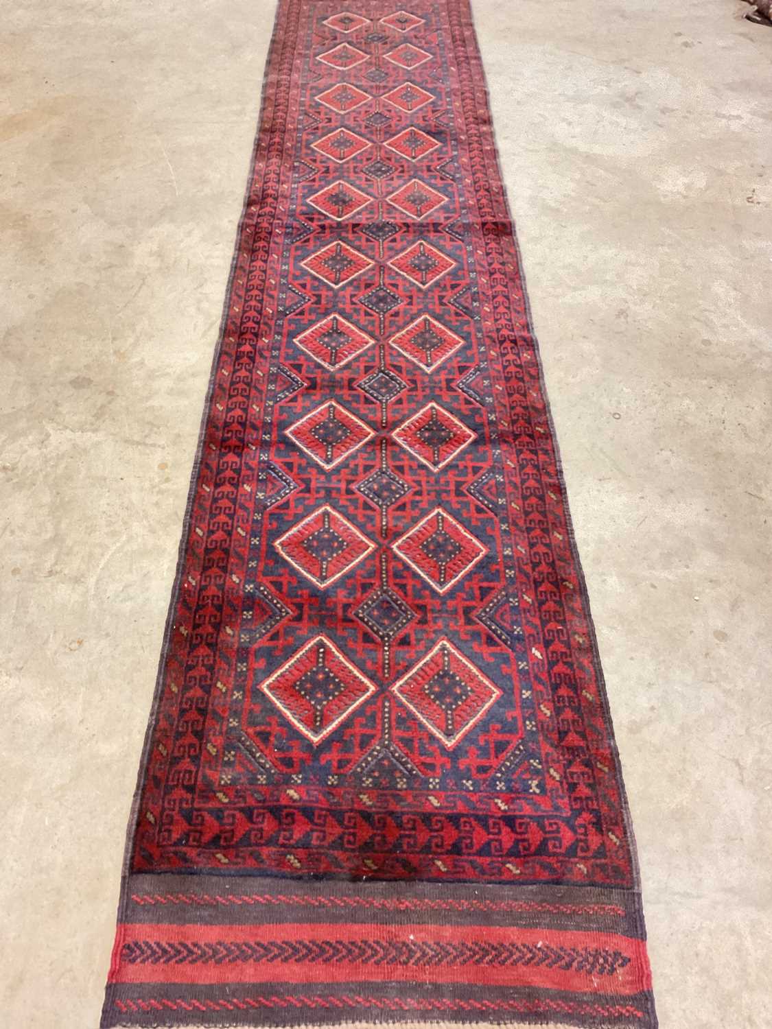 Lot 449 - An Afghan Mushwani runner, 360cm x 70cm.