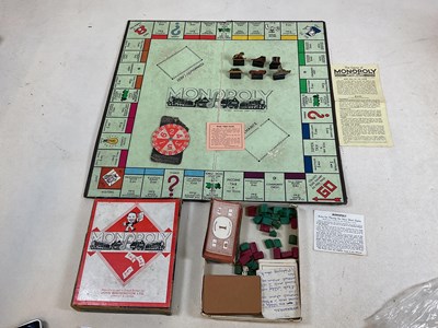 Lot 71 - A post war Monopoly set and board (A/ F) and...