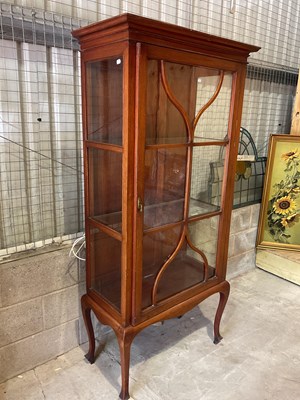 Lot 194 - A tall triple sided glazed display cabinet...