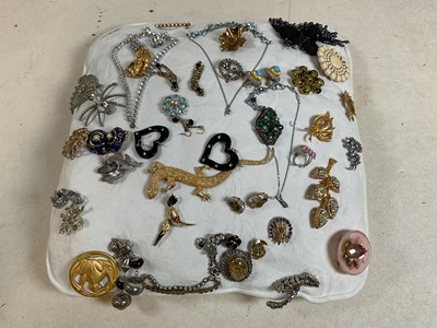 Lot 338 - A collection of costume jewellery presented on...