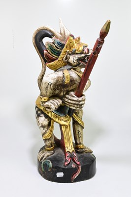 Lot 576 - A painted Balinese figure of a mythical...