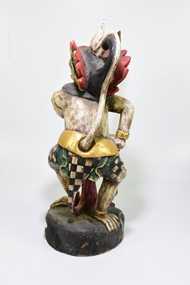 Lot 576 - A painted Balinese figure of a mythical...