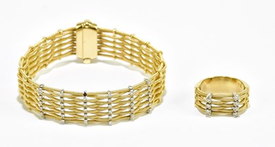 Lot 1311 - A yellow metal textured bracelet set with six...