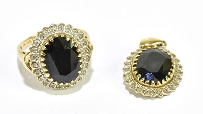 Lot 1296 - A 9ct yellow gold dress ring set with central...