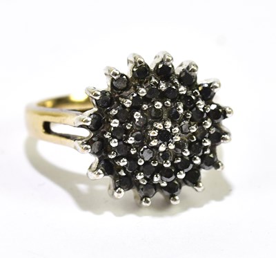 Lot 1056 - A 9ctr yellow gold cluster dress ring set with...